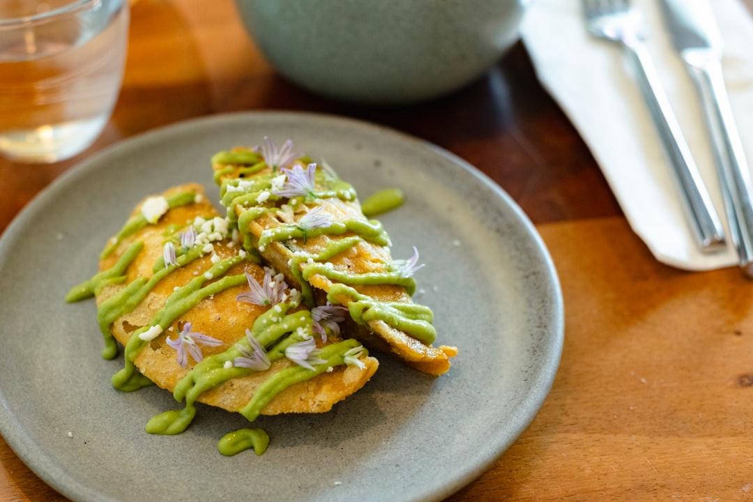 a-plate-of-food-on-a-wooden-table-epidxchycqy