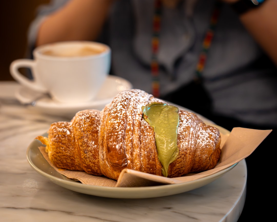 croissant-filled-with-green-cream-and-dusted-with-powdered-sugar-kelsrcszhzs